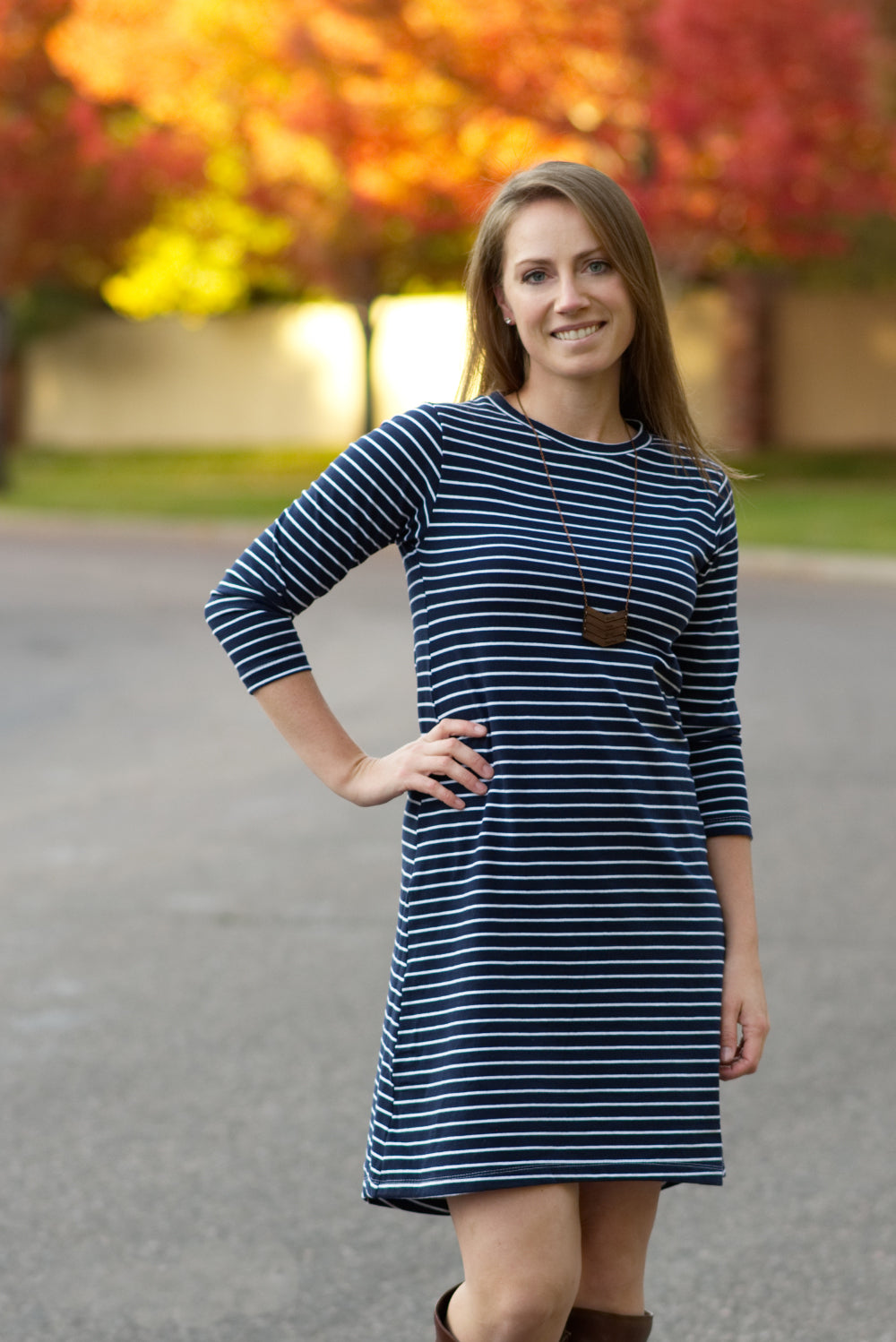 A mid-thigh length Nicolette dress featuring a crew neck and 3/4 length sleeves. 