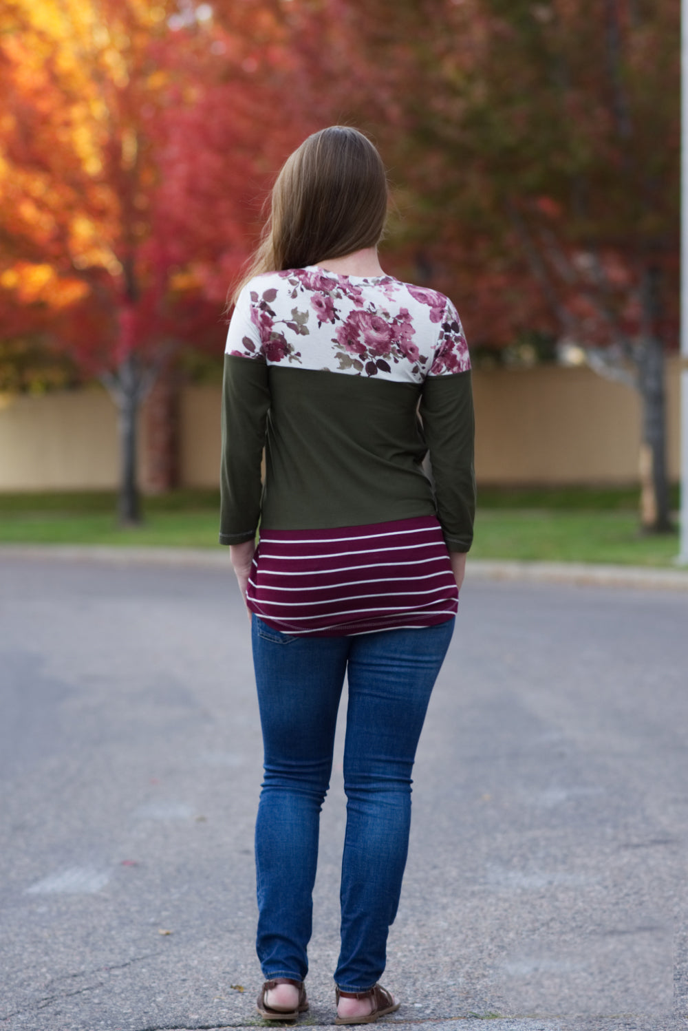 Back view of a long t-shirt length Nicolette with color blocking and 3/4 length sleeves. 