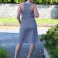 Back view of the Helen Dress. Features a racerback bodice and knee-length skirt. 