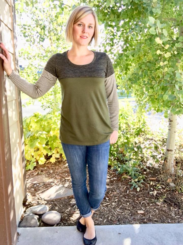 A tunic-length Nicolette shirt with a scoop neck, long sleeves, and color blocking details. 