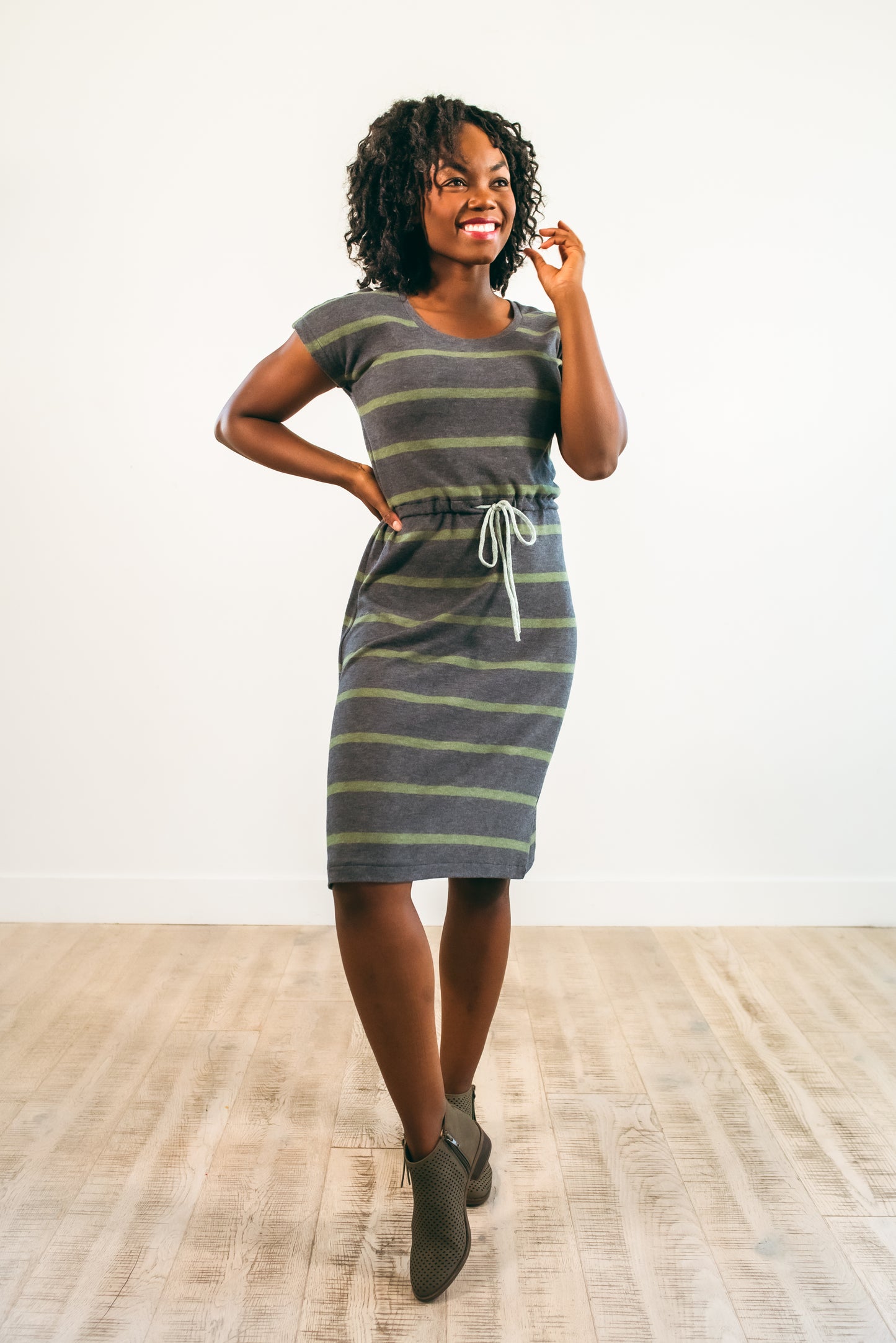 The Helen Dress in misses size. Features a solid front and knee-length skirt. 