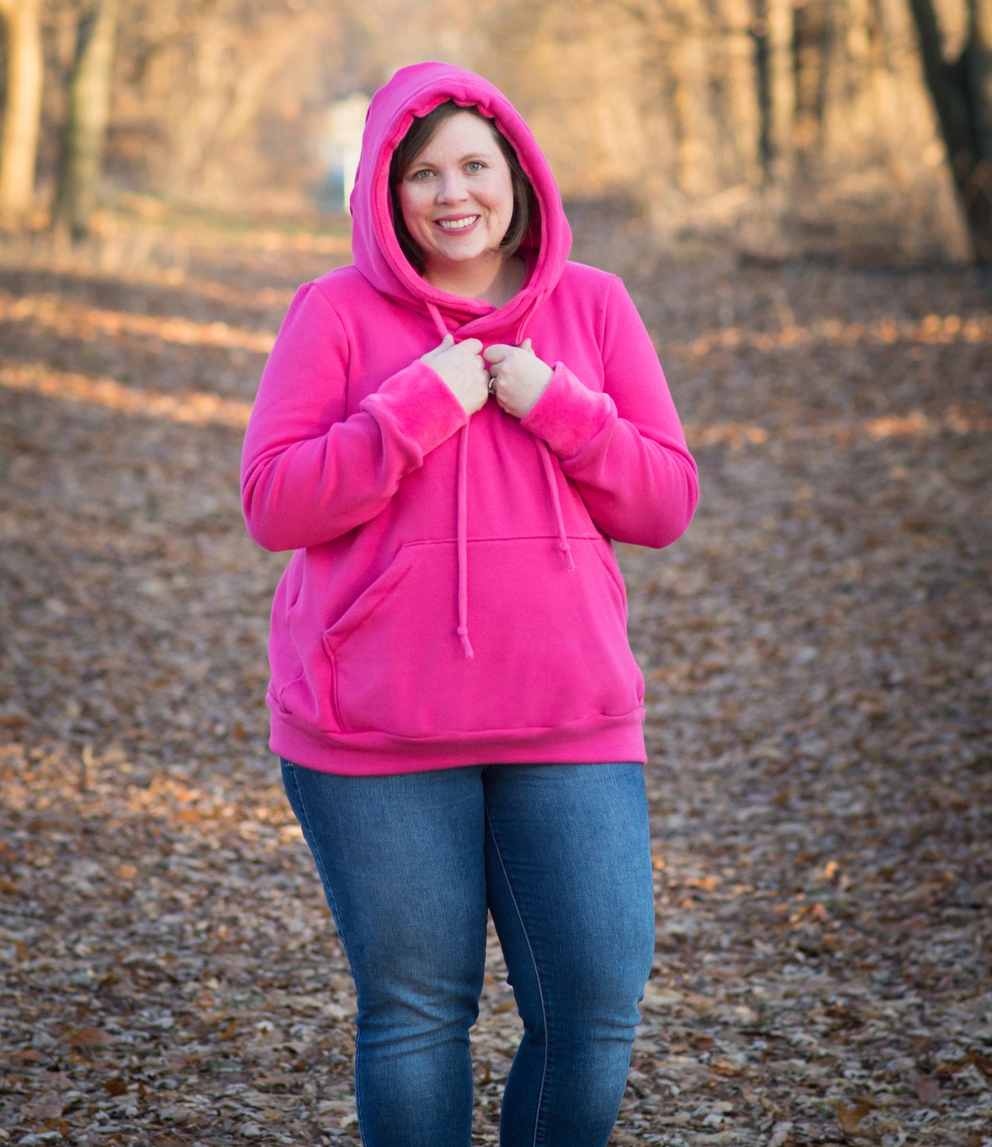 The Melissa Sweatshirt in plus size. Features a hood, kangaroo pocket, and banded hem. 