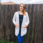 The Grace Cardigan in long length with long sleeves. Features buttons and patch pockets.