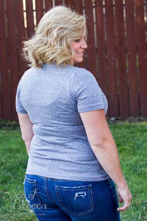 Back view of the Harriet featuring a shirt length bodice, v-neck, and short sleeves.