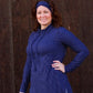 Front view of the Nora sweater with a drawstring funnel neck, long sleeves, and split hem. 