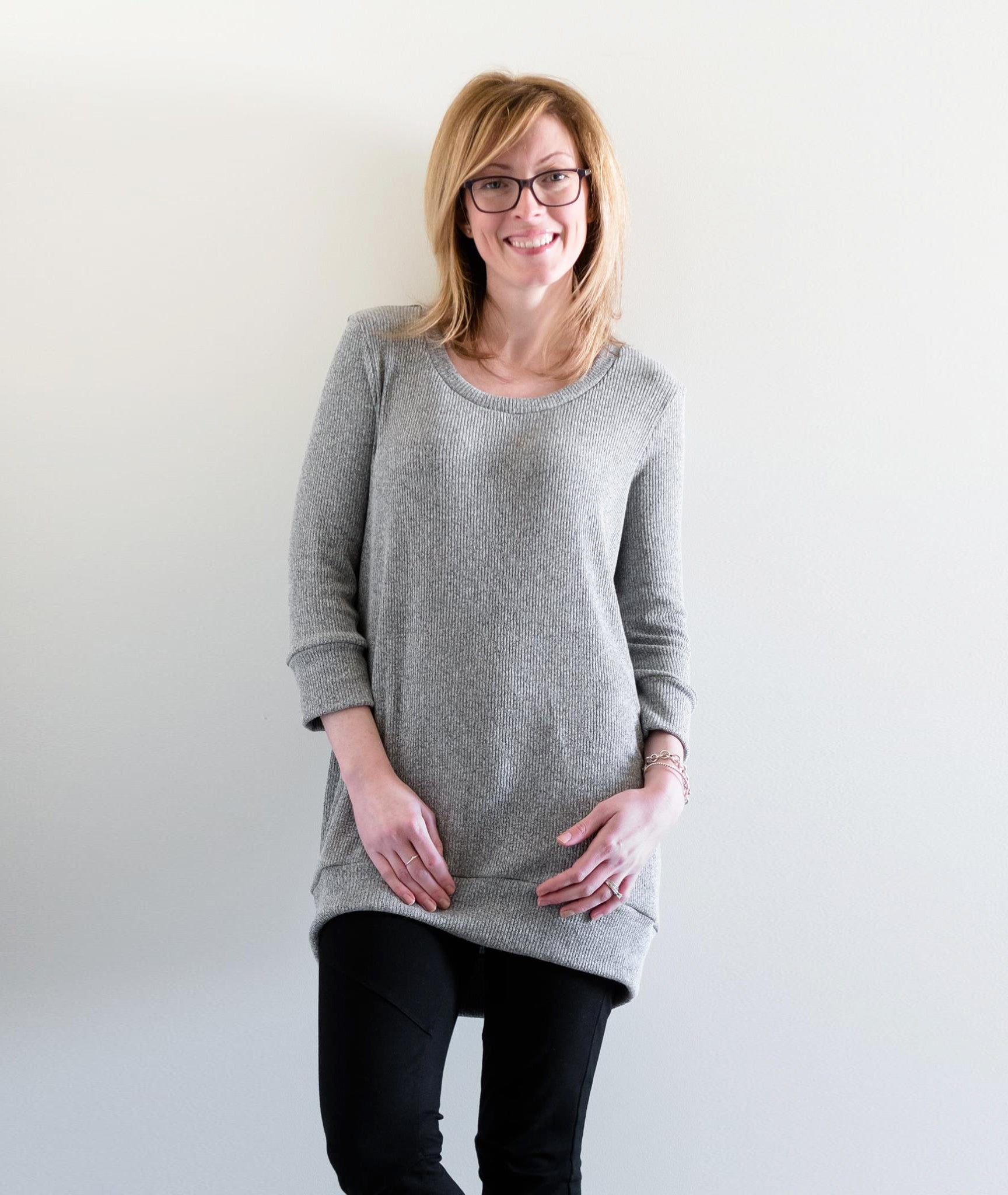 The Nora sweater with 3/4 sleeves, scoop neck, and banded hem. 