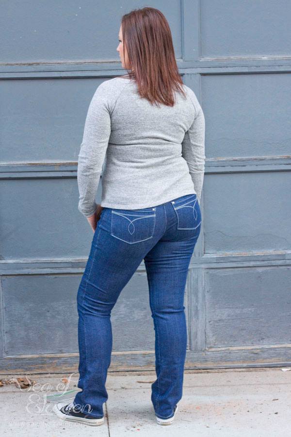 Back view of woman wearing Bravado jeans with decorative pocket stitching