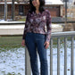 Front view of woman wearing Bravado jeans with topstitching and a pair of boots