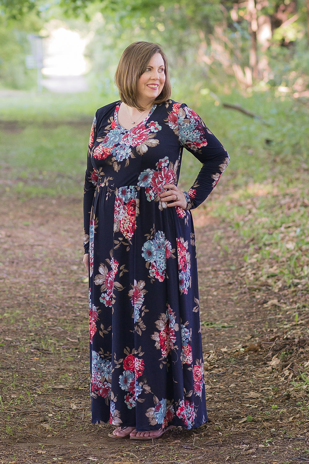 Emmeline in plus size featuring a v-neck, long sleeves, and maxi-length skirt. 