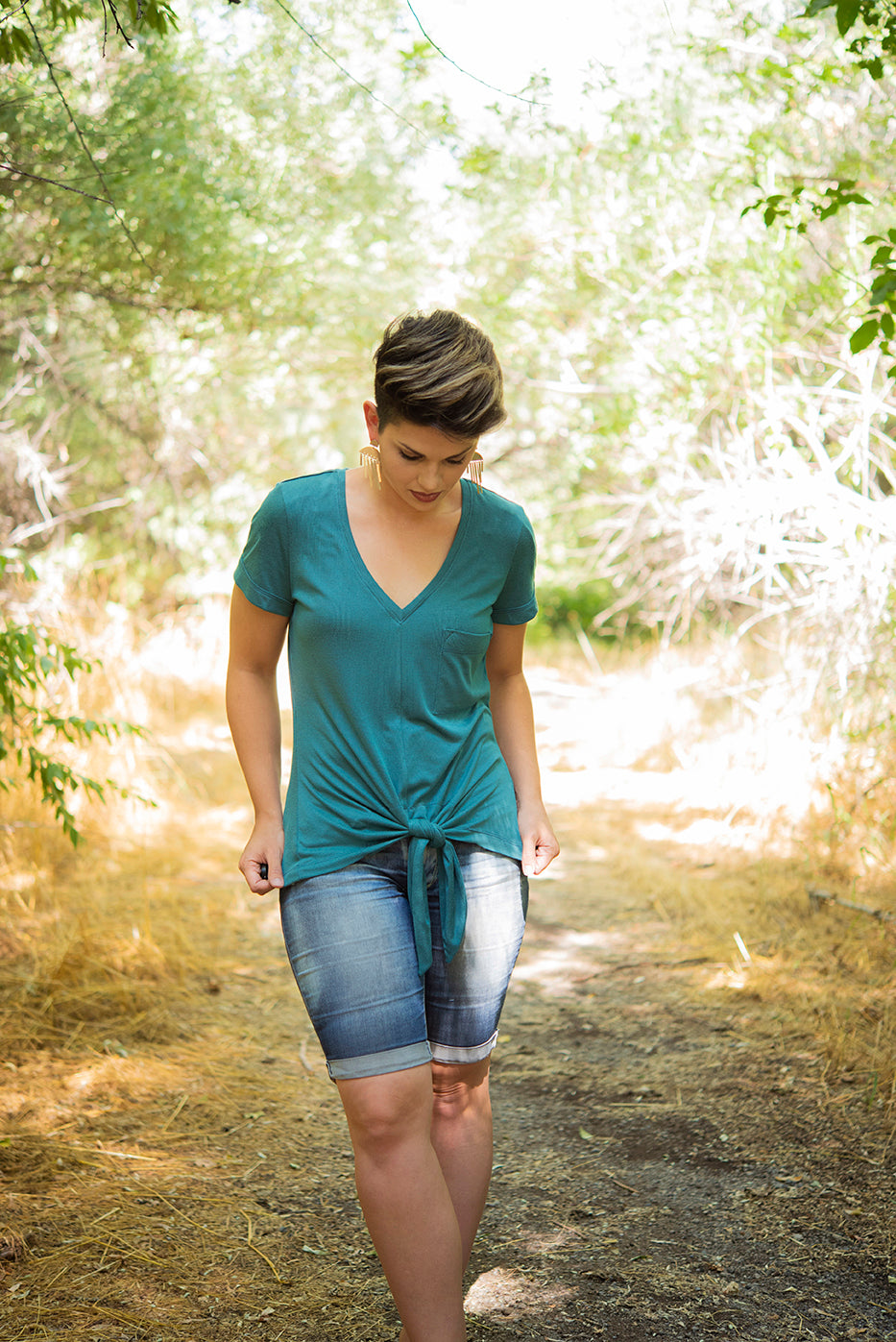 The Harriet featuring a shirt length bodice, plunging v-neck, and short sleeves.