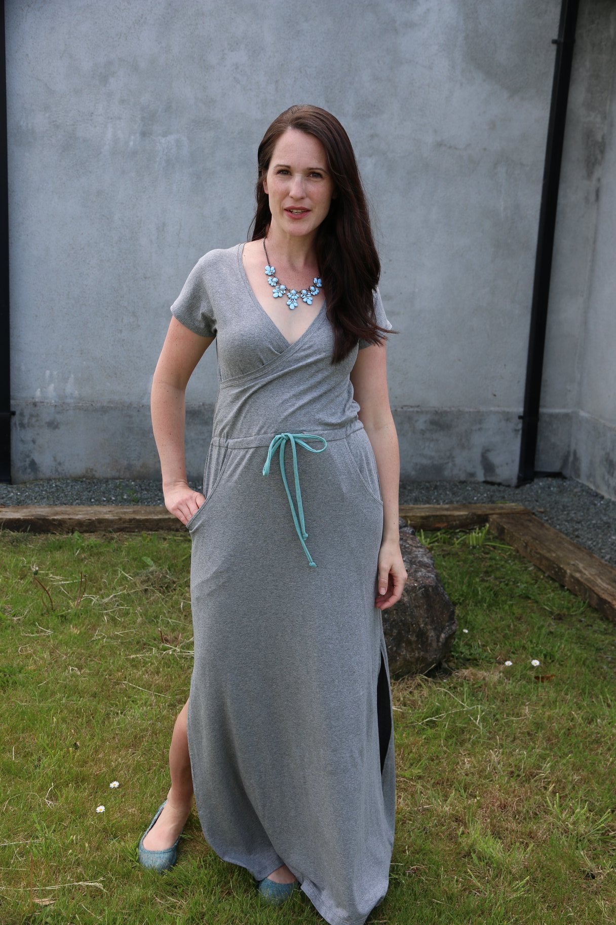 The Helen dress in misses size. Features a cross front, maxi-length skirt with split hem, and pockets. 