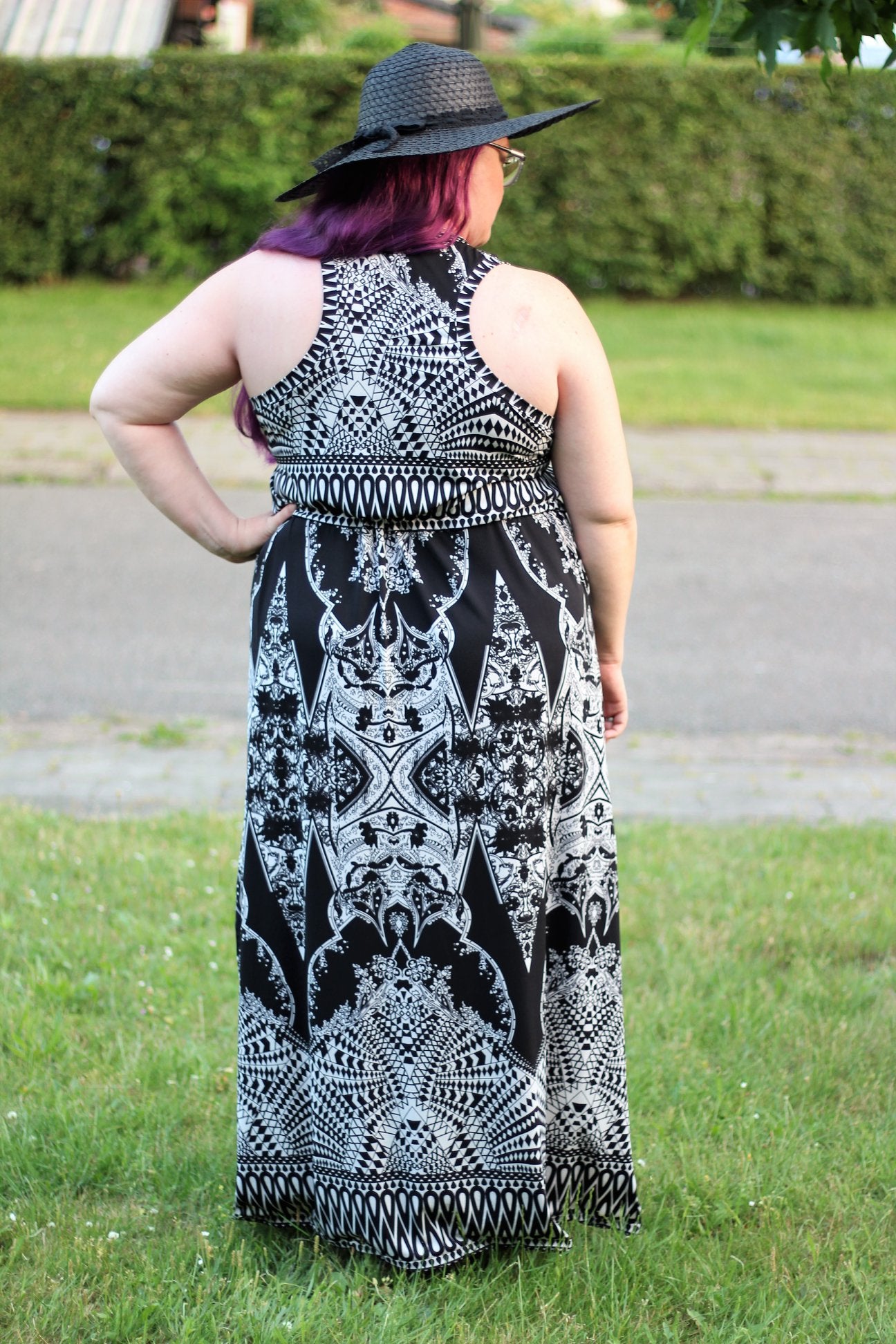The Helen in plus size. Features a racerback bodice and maxi-length skirt. 
