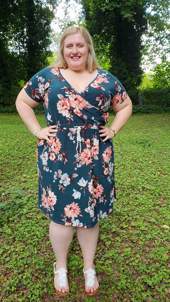 The Helen Dress in plus size. Features a crossover front and knee-length skirt. 